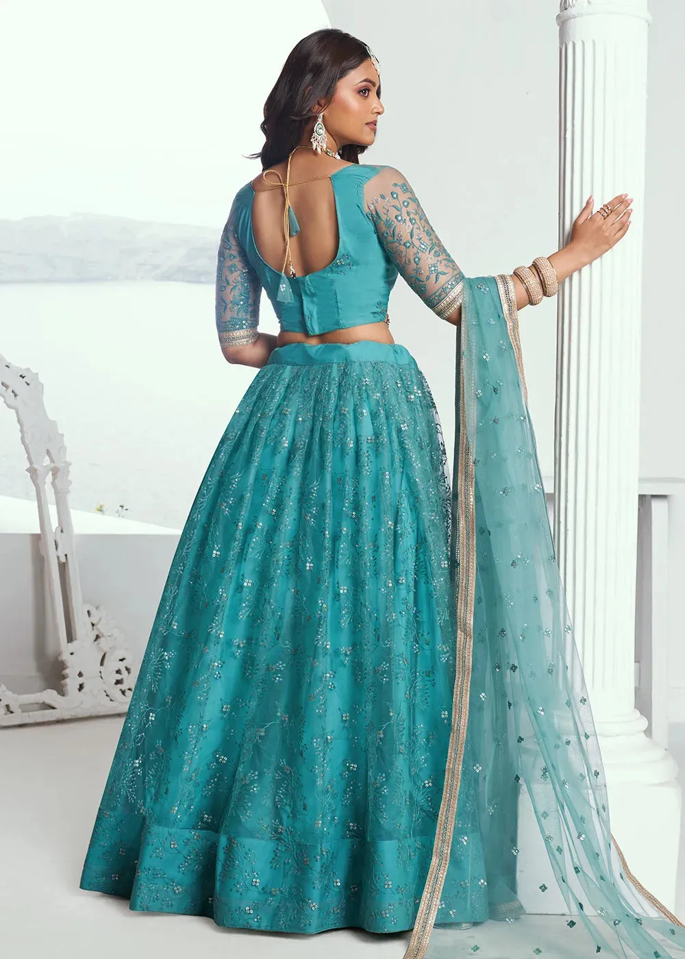 Gorgeous Rama Green Embroidered Net Wedding Lehenga Choli